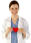 Woman in scrubs holding a paper heart. - Copyright – Stock Photo / Register Mark