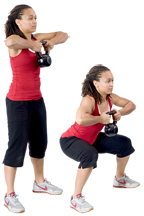 Personal trainer Chelsea Cooper domonstrates The Squat with a Kettlebell. - Copyright – Stock Photo / Register Mark