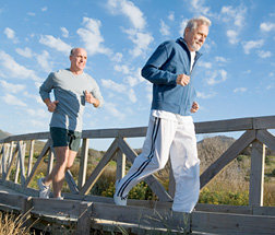 Father and son running at the beach. - Copyright – Stock Photo / Register Mark