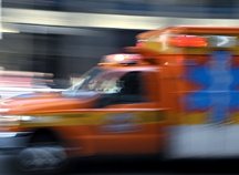 An ambulance speeding by. - Copyright – Stock Photo / Register Mark